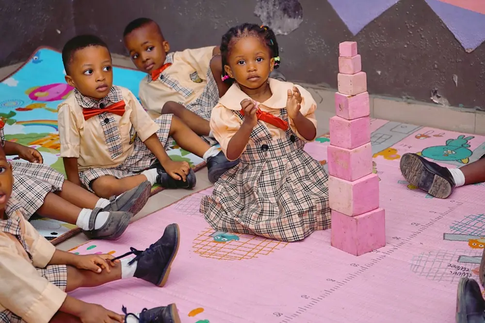 Nursery children building with coloured blocks