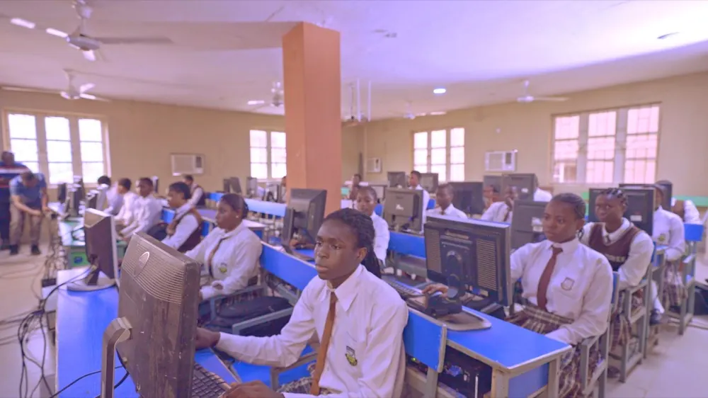 The computer-based test hall in use, every seat filled