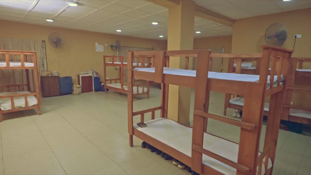 A boarding dormitory with wooden bunk beds